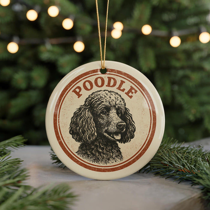 A circular ornament featuring a poodle's portrait, with the word "Poodle" written around the edge.