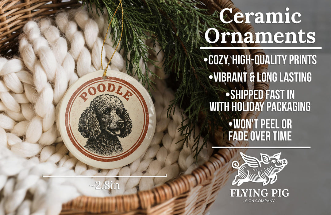 Ceramic ornaments featuring a poodle image, with a wicker basket and greenery in the background.