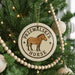 A Christmas tree decorated with ornaments, including a round ornament with a horse image and the text "Przewalski's Horse".