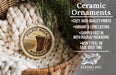 Ceramic ornaments, featuring a wooden ornament with a mountain landscape and text, are displayed in a basket with pine branches.