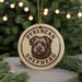 A circular ornament featuring a close-up of a Pyrenean Shepherd dog's face, with the text "PYREAN SHEPHERD" printed on it.
