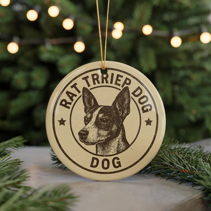 A round ornament with a dog's head and the text "RAT TRIPER DOG" printed on it, hanging from a string.