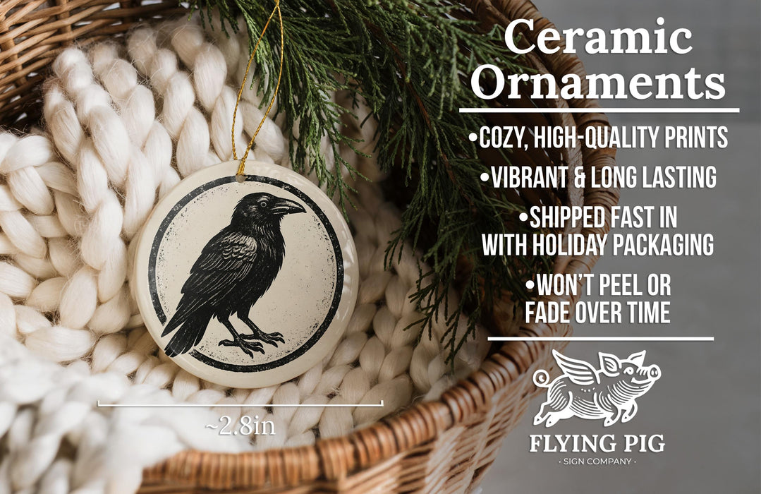 Ceramic ornaments, featuring a black and white illustration of a bird, are displayed in a woven basket.