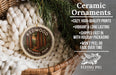 Ceramic ornaments, featuring a ceramic ornament with a forest scene and text, placed in a woven basket with pine branches.