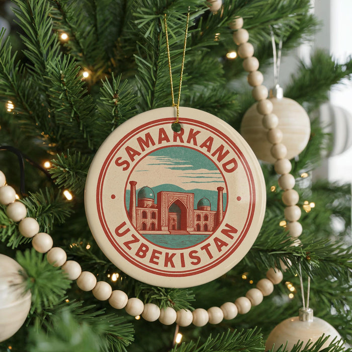 A circular ornament on a Christmas tree, featuring the text "SAMARKAND UZBEKISTAN" and an illustration of a mosque.