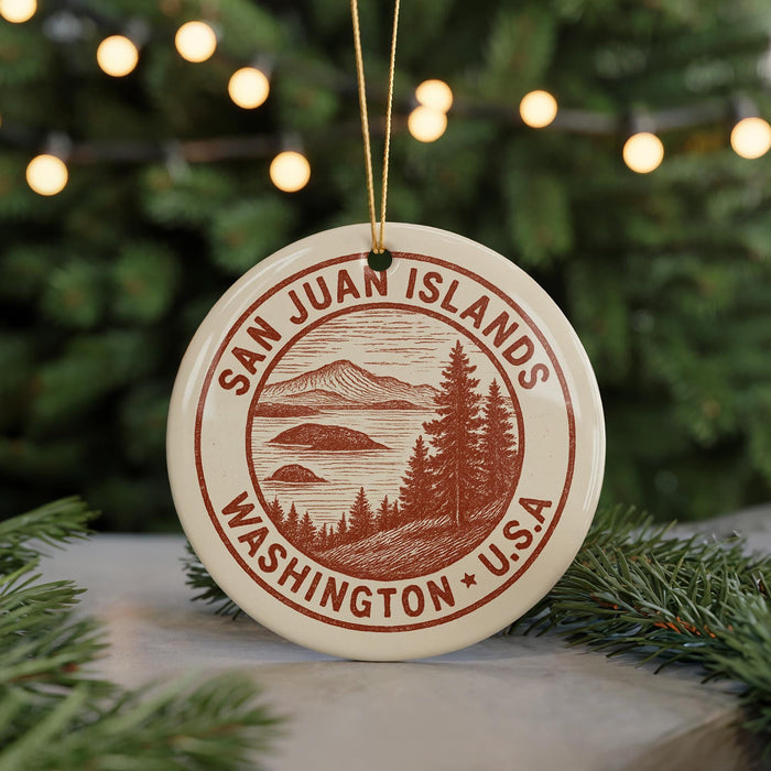 A circular ornament with the text "SAN JUAN ISLANDS WASHINGTON, U.S.A." printed on it, surrounded by pine branches and twinkling lights.