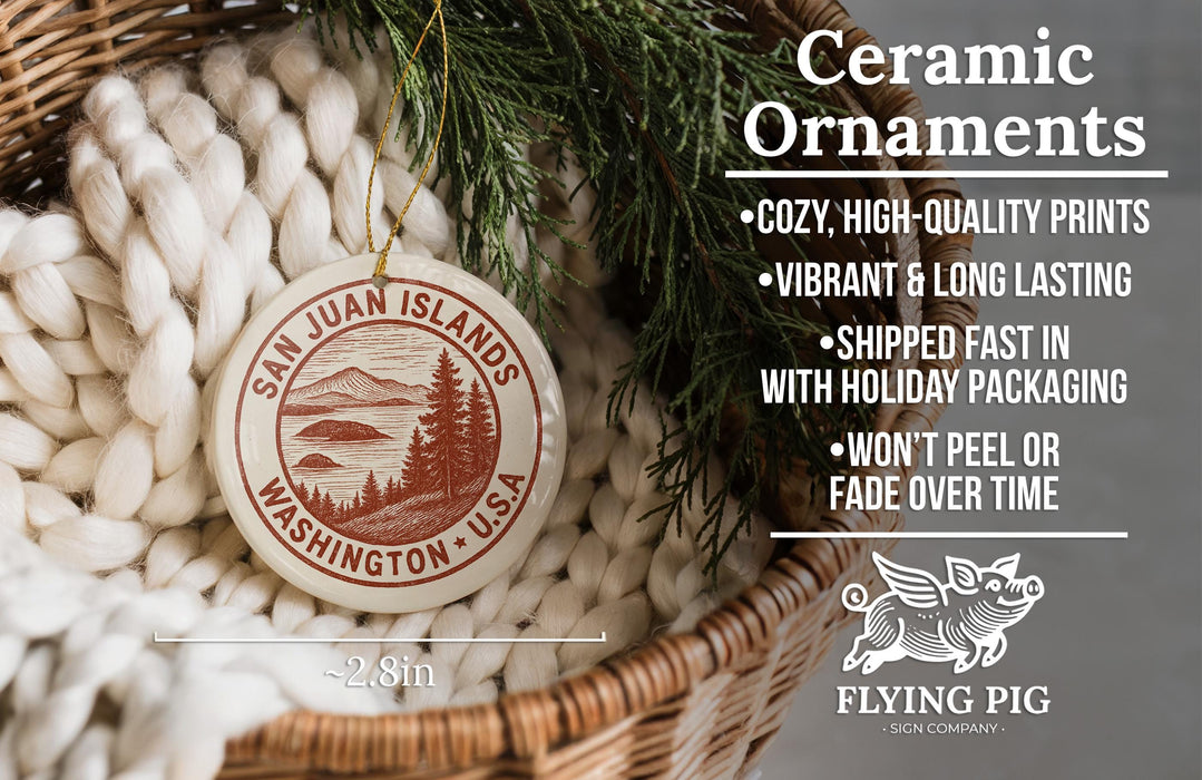 Ceramic ornaments, featuring a round ornament with a landscape design, are displayed in a woven basket.