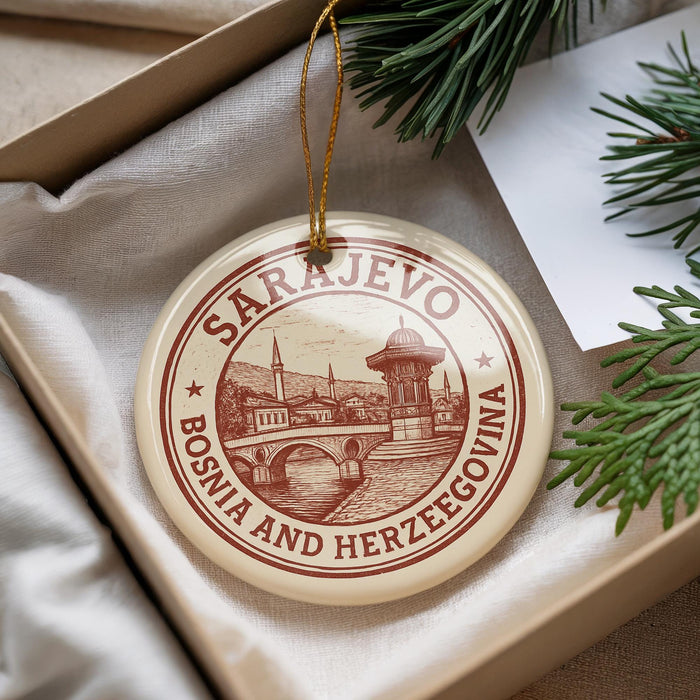 A circular ornament with the text "SARajevo, Bosnia and Herzegovina" printed on it, hanging from a string.