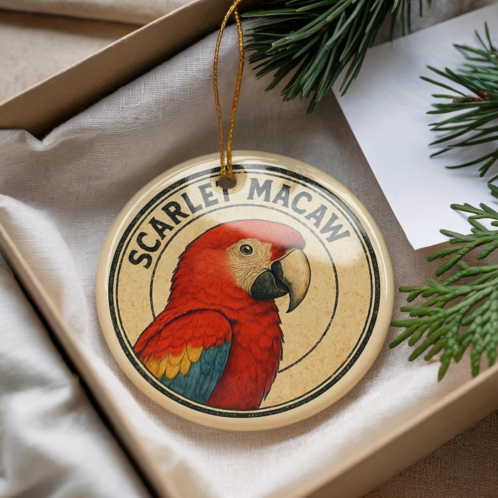 A round ornament featuring a red parrot, with the text "SCARLET MACAW" around the edge.
