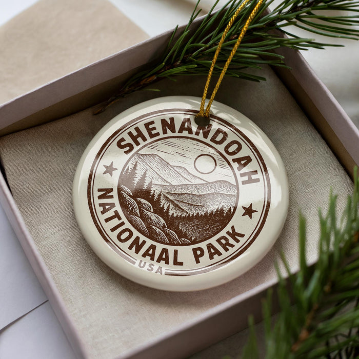 A circular ornament with the text "Shenandoah National Park" printed on it, surrounded by pine branches and pine needles.