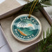 A round ornament with a tropical beach scene and palm trees, featuring the text "SIARGAO PHILIPPINES".