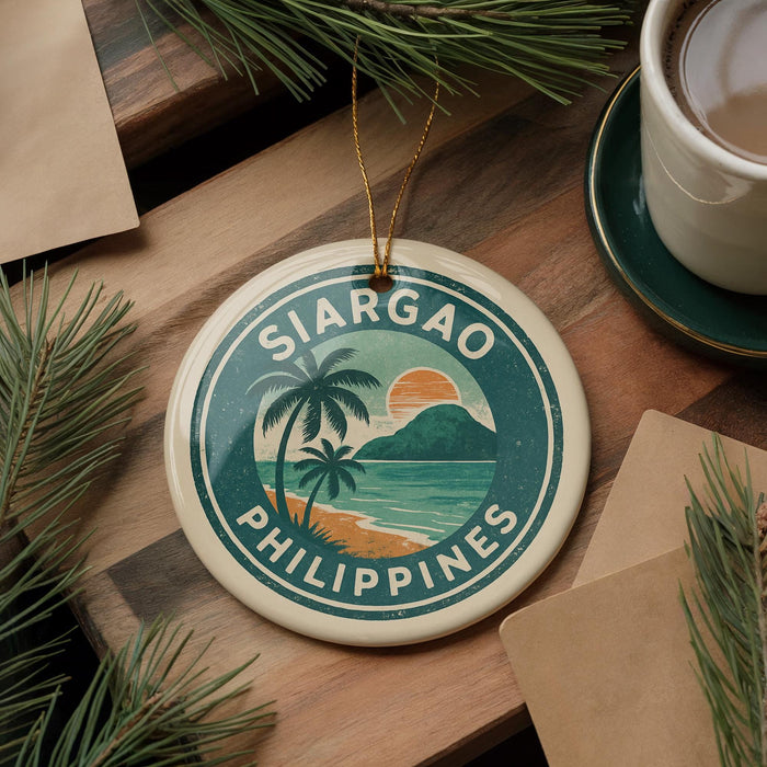 A round ornament with the text "SIARGAO PHILIPPINES" and a tropical beach scene, hanging on a wooden surface.