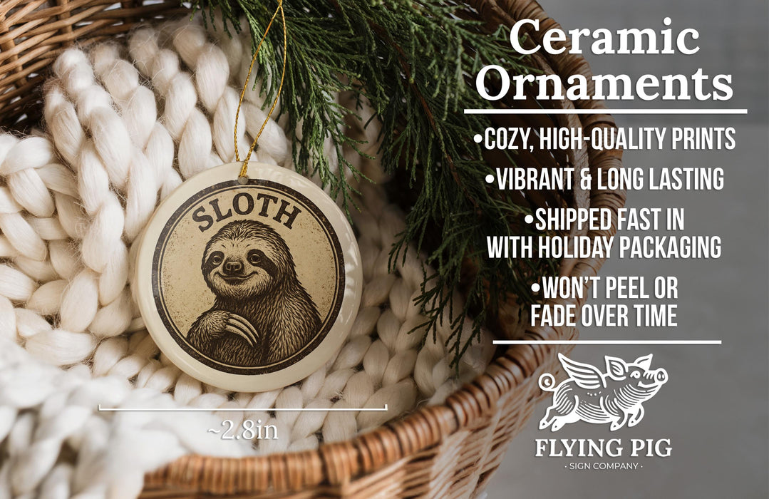 Ceramic ornaments featuring a sloth, a type of primate, are displayed in a basket with a pine branch.