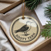A round ornament with a bird image and the text "Sooty Tern" is displayed in a box with pine branches.