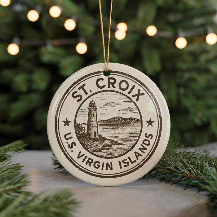 A circular ornament with the text "ST. CROIX U.S. Virgin Islands" printed on it, featuring a lighthouse and a coastal landscape.