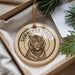 A decorative ornament featuring a close-up image of a tiger's face, with the text "SUMATRAN TIGER" around the edge.
