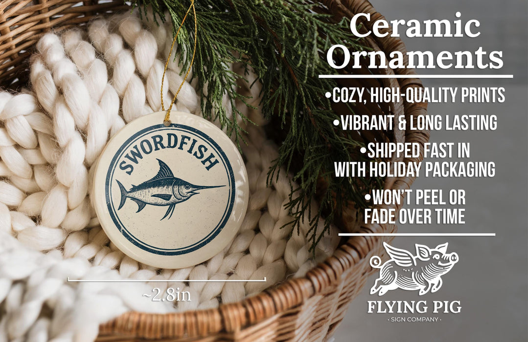 Ceramic ornaments, featuring a swordfish design, are displayed in a woven basket.