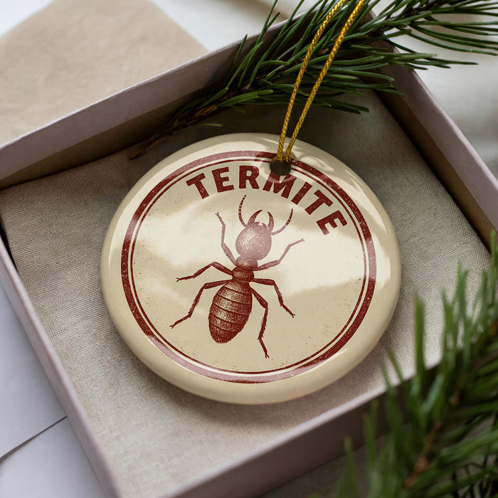 A round ornament with the word "TERMITE" printed on it, featuring a red and white design of a termite.