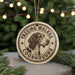 A circular ornament featuring a beagle dog's head, with the text "TREEEING WALKER COONHOUD" around the edge.