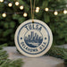 A circular ornament with the text "TULSA OKLAHOMA U.S.A." and a graphic of a city skyline.