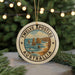 A circular ornament with the text "TENUTE APOSTLES AUSTRALIA" and an illustration of the Twelve Apostles rock formation, which is a famous landmark in Australia.