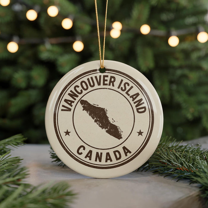 A white ornament with the text "VANCOUVER ISLAND CANADA" printed on it, featuring a map of Canada.