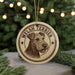 A circular ornament featuring a Welsh Terrier dog's head, with the text "WELSH TERRIER" printed on it.