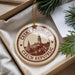 A circular ornament with a picture of a town and the text "CESKY KRUMLOV CZECH REPUBLIC" is displayed in a box with pine branches.