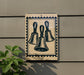 a sign with a graphic of three bells, mounted on a wall.