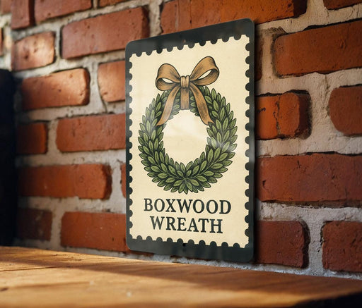 A decorative wreath with a bow on top, mounted on a brick wall.