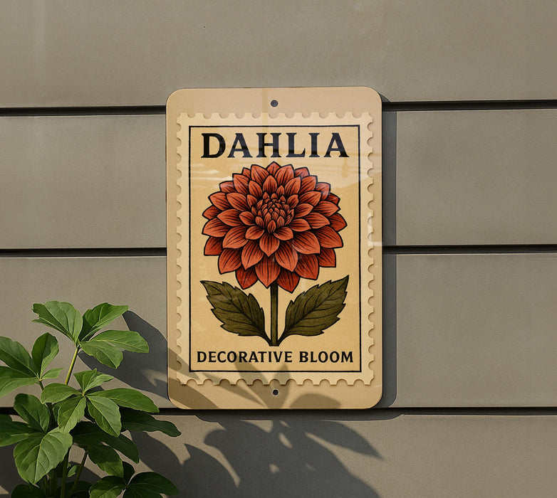 A decorative flower sign with the word "Dahlia" on it, mounted on a wall next to a plant.