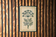 a decorative floral design on a wooden panel.
