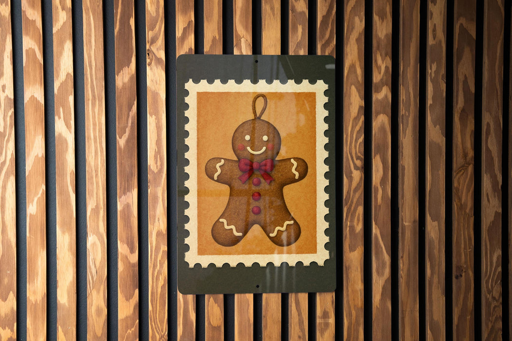 A gingerbread man illustration is displayed on a wooden wall, framed by a black border.