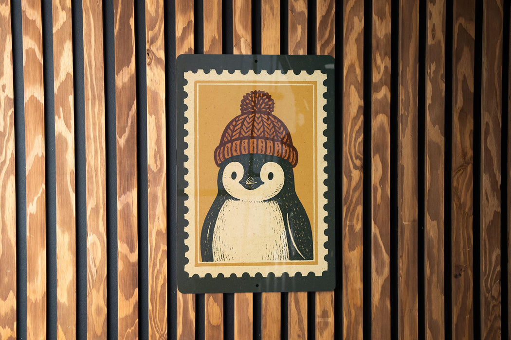 A penguin wearing a knitted hat is depicted on a sign against a wooden background.