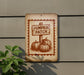 a sign that reads "Pumpkin Patch" with three pumpkins depicted on it, mounted on a wall.