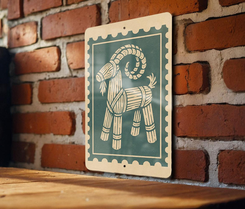 A green and white sign featuring a stylized illustration of a goat is mounted on a brick wall.