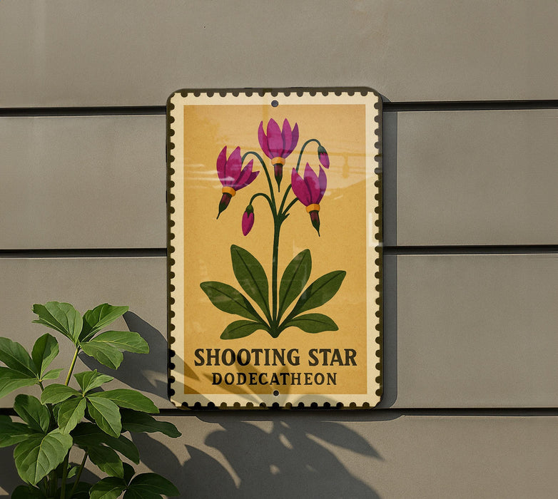 A sign with a yellow background and a picture of purple flowers is mounted on a gray wall.