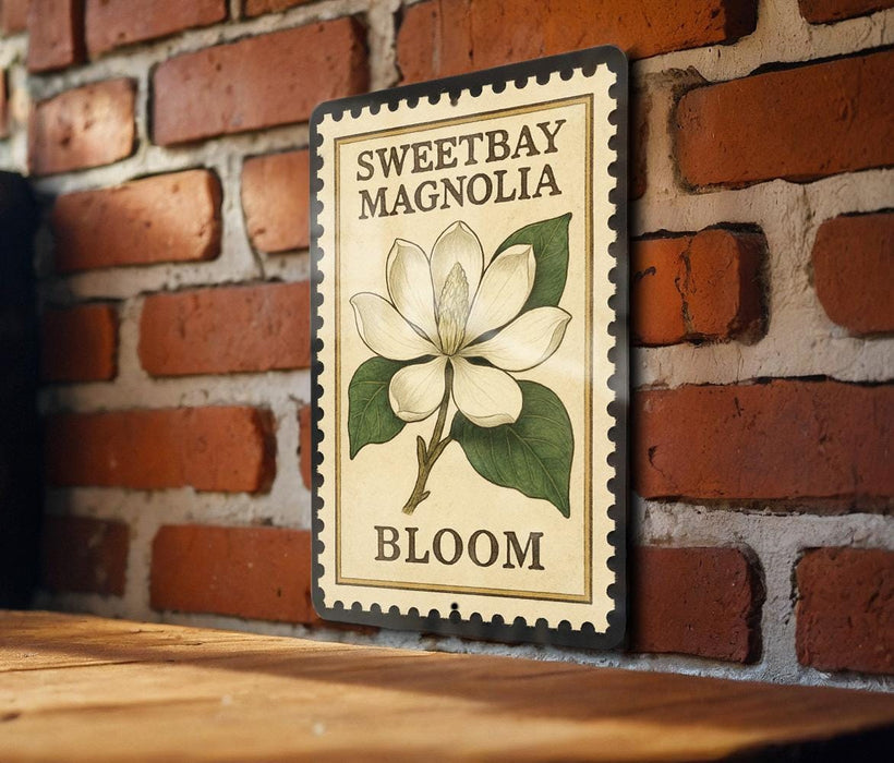 A vintage-style metal sign with a white magnolia flower and green leaves, mounted on a brick wall.