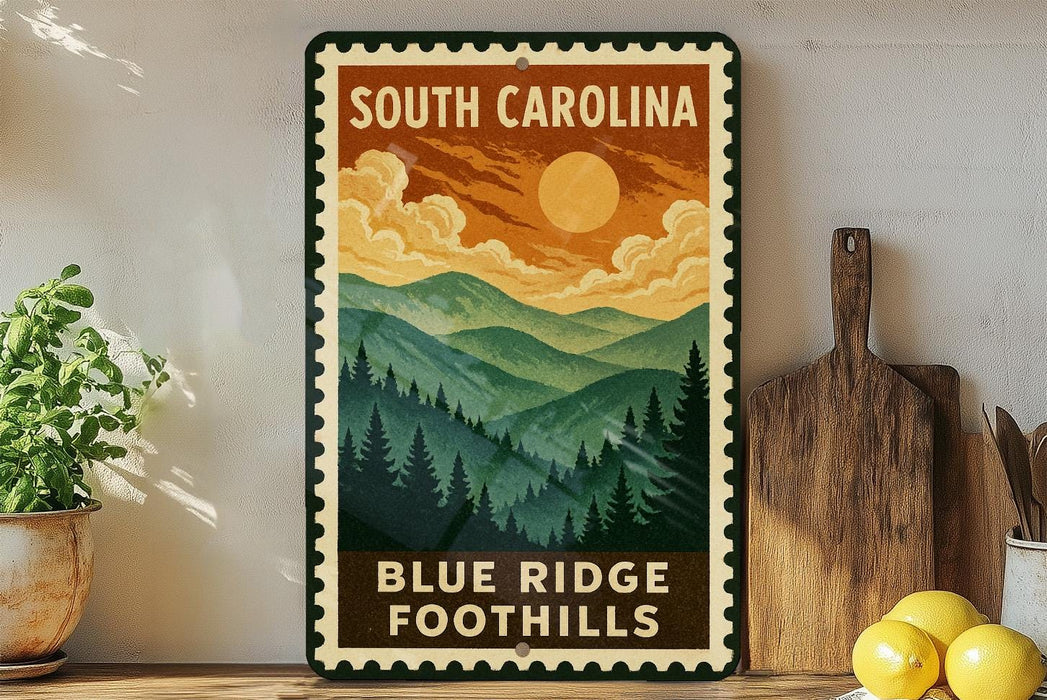 A vintage-style metal sign for Blue Ridge Foothills in South Carolina, featuring a mountain landscape with pine trees and a sun in the sky.