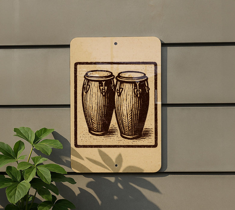 a sign with a drawing of two drums mounted on a wall.