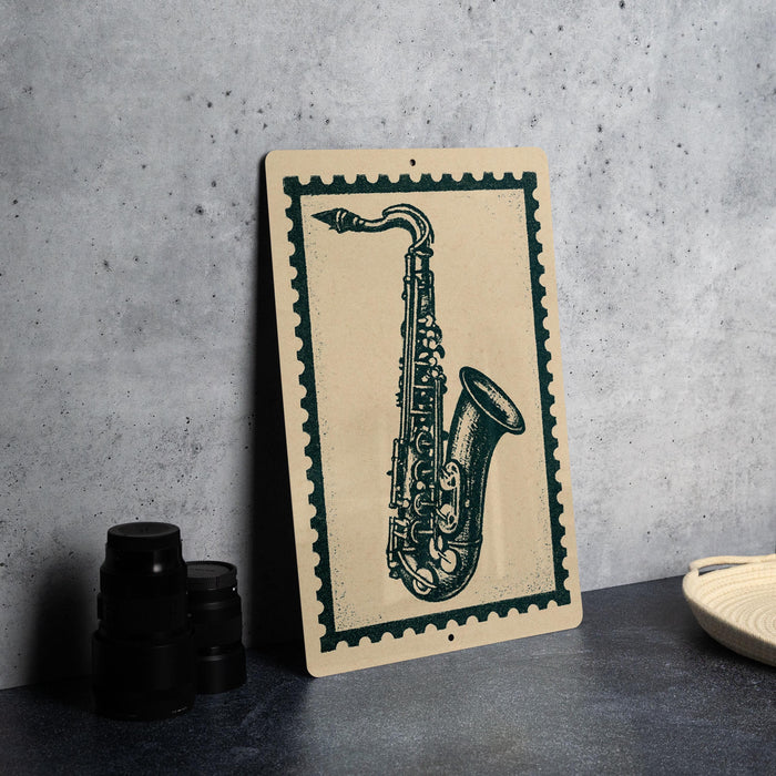 a framed illustration of a saxophone on a wall, with a stack of black camera lenses placed next to it.