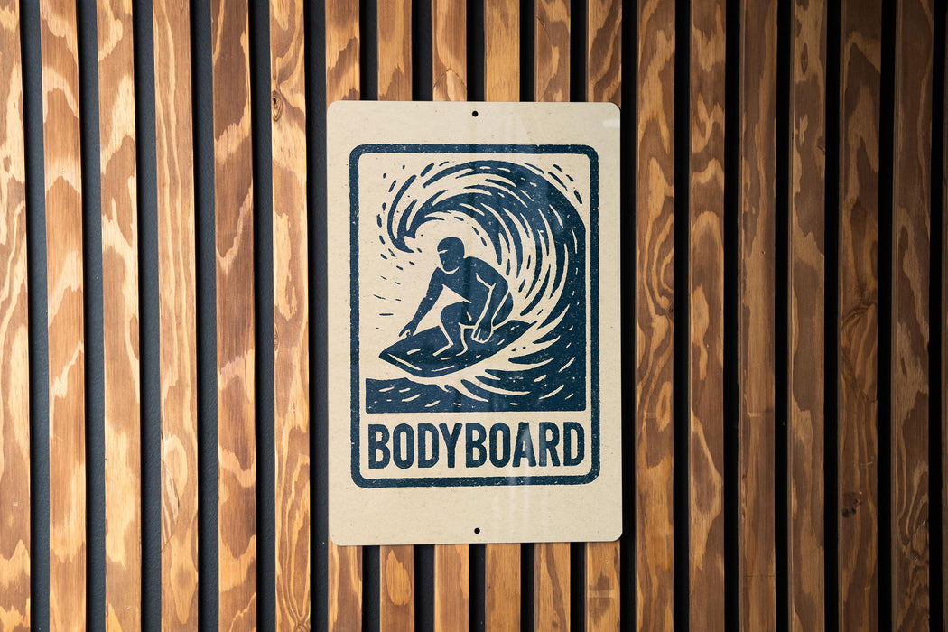 A sign with the word "BODYBOARD" printed on it, featuring a silhouette of a surfer riding a wave.