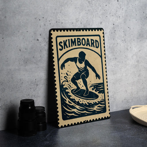 A metal sign with a graphic of a surfer on a wave, along with the text "SKIMBOARD" and a stamp-like border.