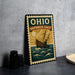 A vintage-style metal sign with a ship illustration and the text "OHIO SHIPPWRECK COAST" is displayed on a gray countertop.