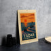 A vintage-style poster of Zadar, the Sea Organ Sunset, featuring a sunset over the sea with silhouettes of people and a sailboat.