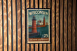 A Wisconsin postage stamp featuring a lighthouse scene, with the text "WISCONSIN" and "LAKESHORE Lighthouses" prominently displayed.