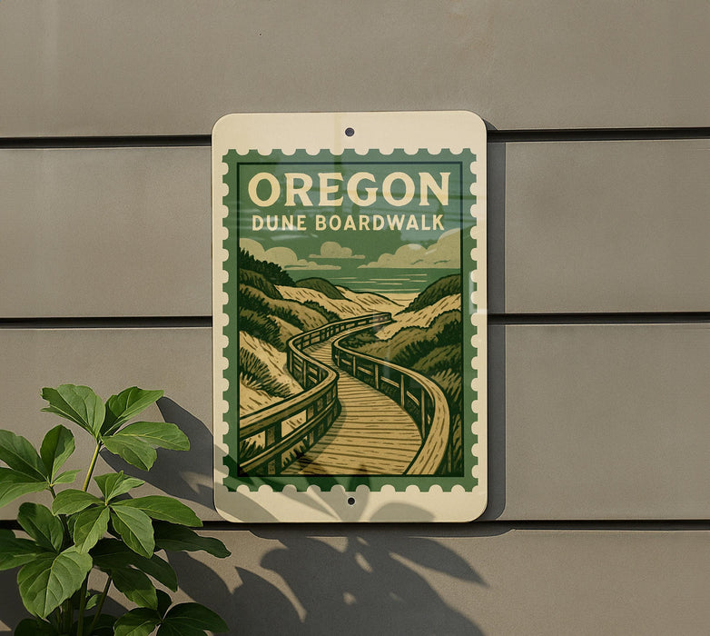 A sign for Oregon Dune Boardwalk is displayed on a wall, featuring a scenic illustration of a wooden boardwalk winding through a mountainous landscape.