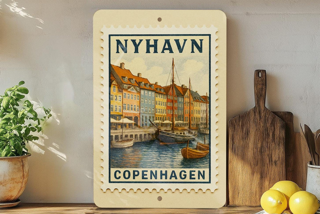 A framed vintage postage stamp depicting a colorful scene of a harbor in Copenhagen, Denmark.