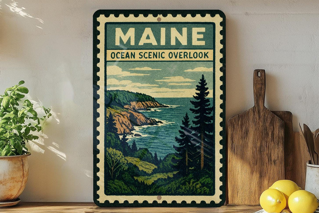 A framed vintage-style poster of Maine's oceanic scenery, featuring a coastal landscape with mountains, pine trees, and the ocean.