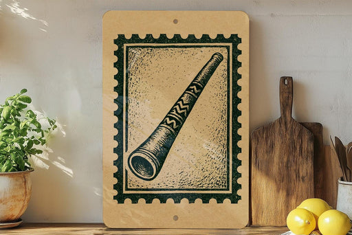 a wooden frame with a stamp-like design on it, placed on a shelf next to a potted plant and a wooden cutting board.